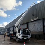 T330 cherry picker cleaning solar panels in Yorkshire