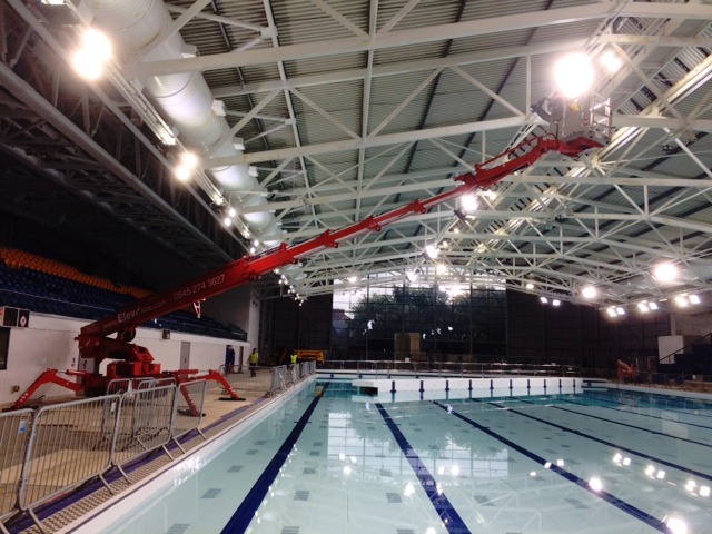 Tracked access platform over a swimming pool