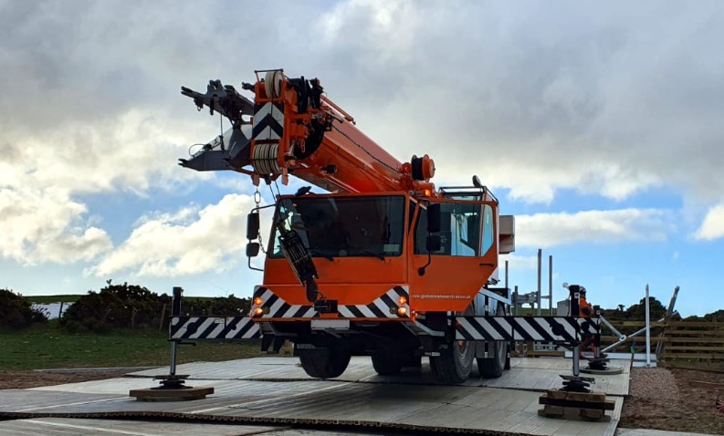 All terrain mobile crane lifting telecoms tower in Scotland